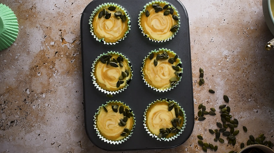 Pumpkin Cream Cheese Muffins Recipe: Sprinkle the edges of the muffins with the pumpkin seeds.