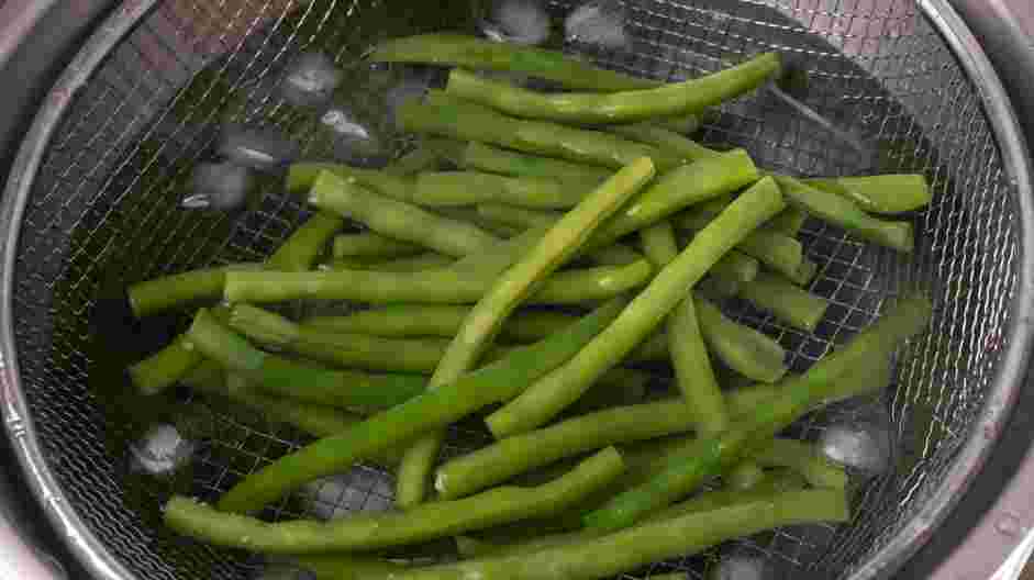 Green Bean Almondine Recipe: Drain the green beans and move them to the prepared ice water.