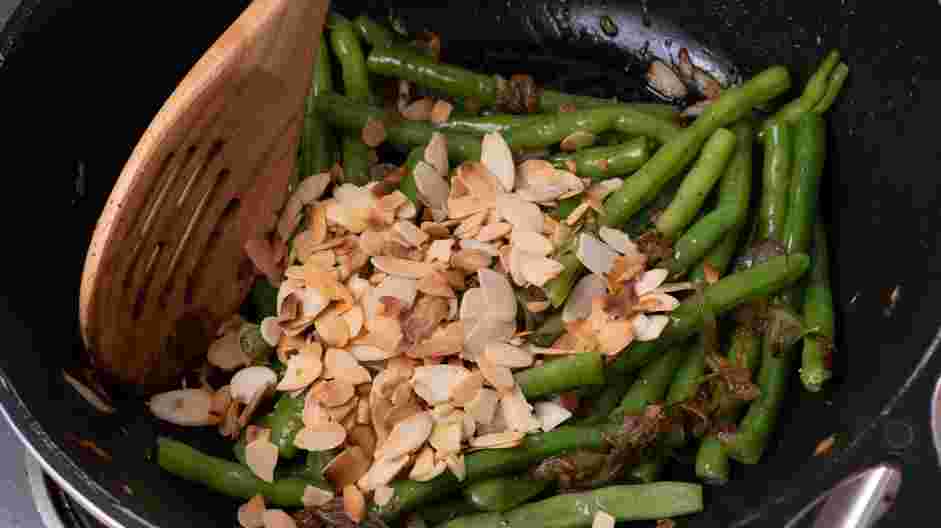 Green Bean Almondine Recipe: Reserve 2 tablespoons of the toasted almonds and add the rest of the almonds to the green bean mixture and mix thoroughly.