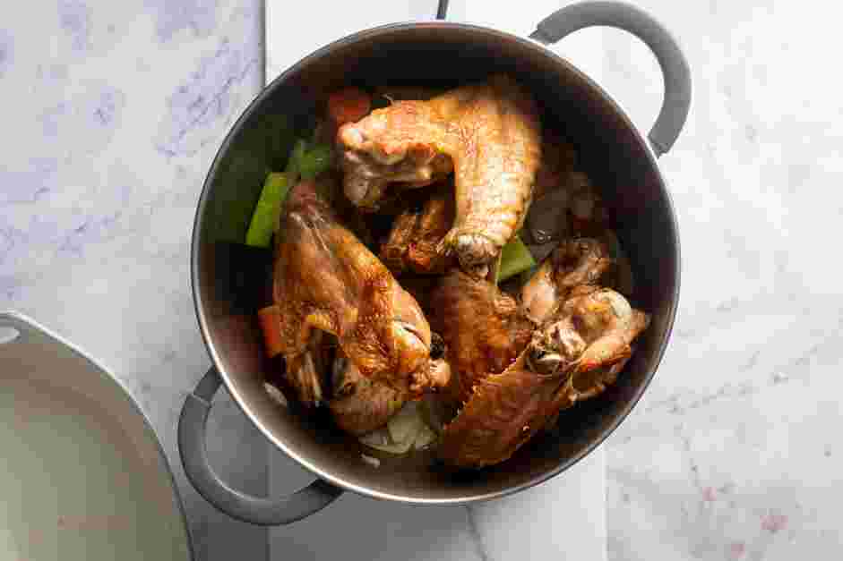 Turkey Stock Recipe:
Turn off the heat and add the turkey wings and pan juices from the roasting pan to the pot.