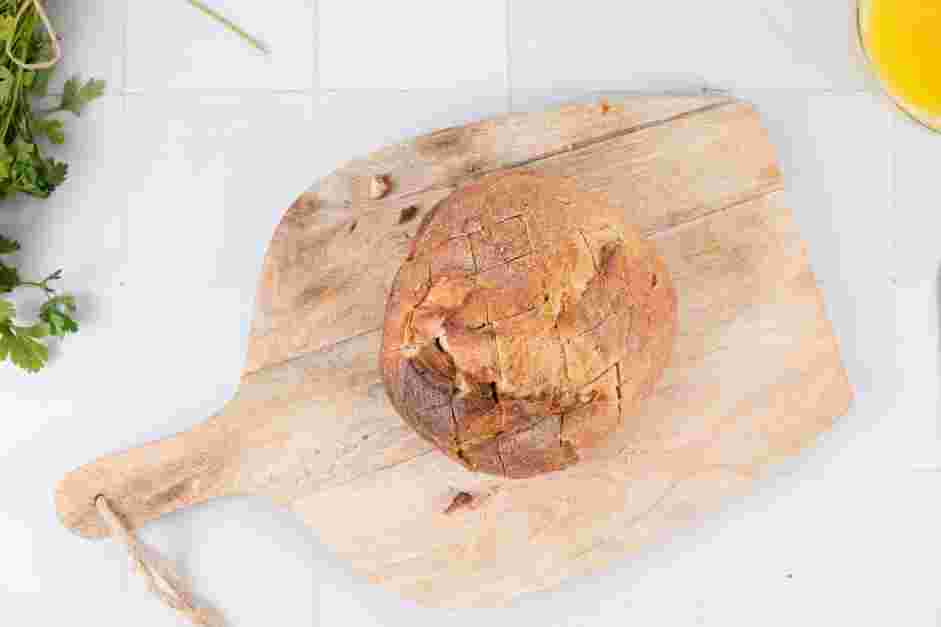 Pull Apart Bread Recipe:
Using a bread knife, slice the bread in 1-inch diagonal cuts, being careful to stop about a ¼-inch from the bottom, to create a crisscross pattern.