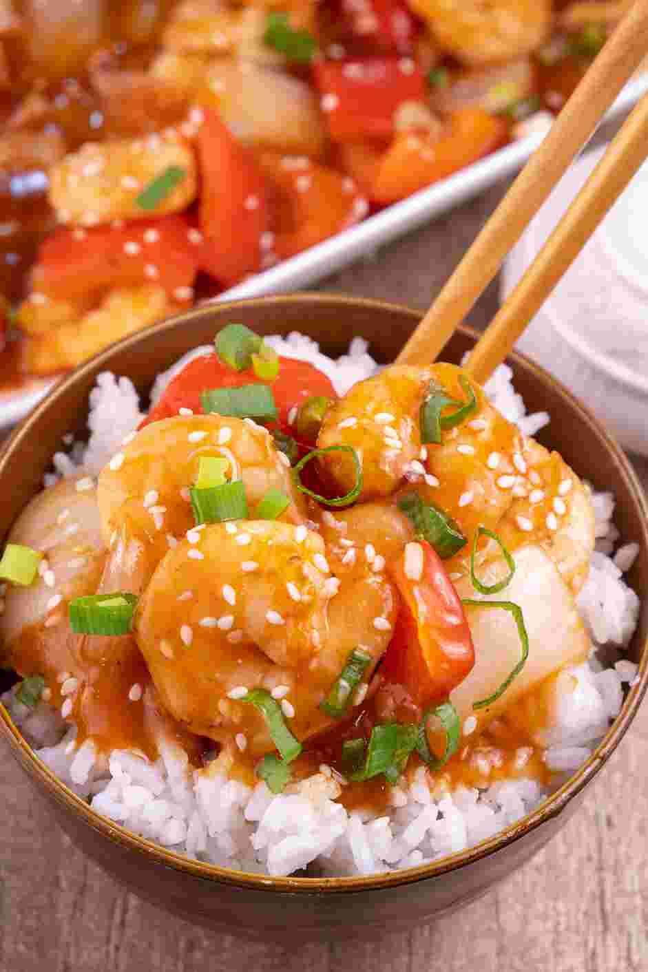 Sweet and Sour Shrimp Recipe: Garnish with spring onions and sesame seeds.