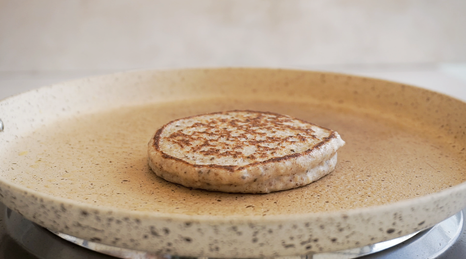 Gluten Free Banana Pancakes Recipe: Flip the pancakes to finish cooking.