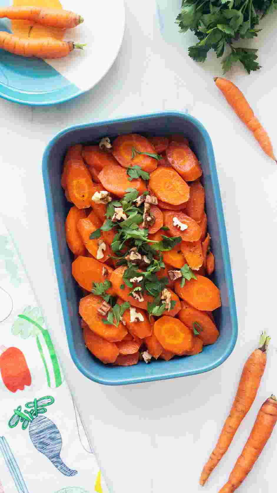 Maple Glazed Carrots Recipe: Top with pecans and parsley and serve warm.