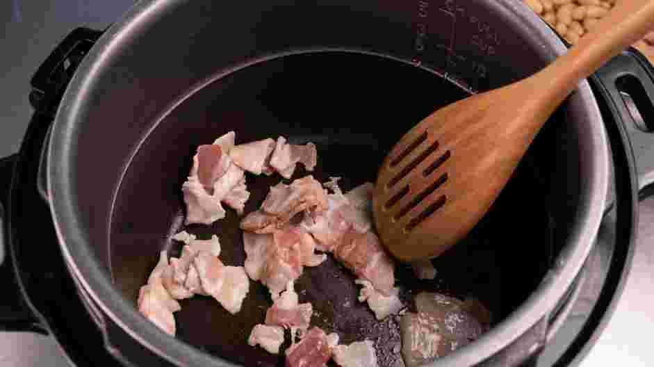 Instant Pot Baked Beans Recipe: Set the Instant Pot to the sauté setting.