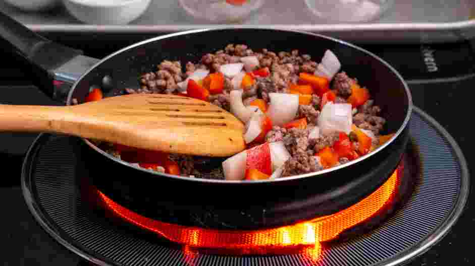 Breakfast Skillet Recipe: Add the bell peppers and onions and cook until it starts to soften, about 2 minutes.