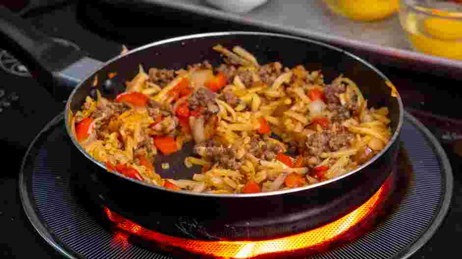 Breakfast Skillet Recipe: Make 2 wells in the potato mixture.