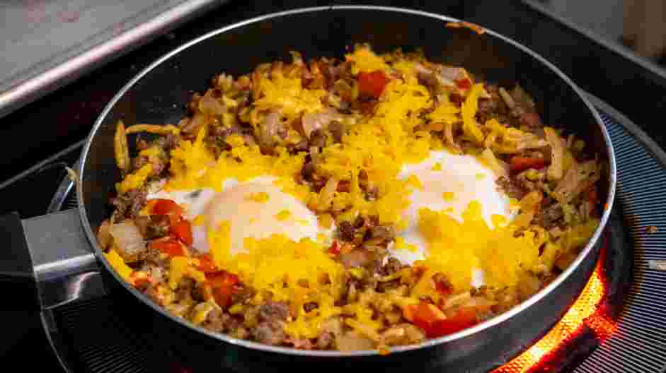 Breakfast Skillet Recipe: Sprinkle the cheddar cheese on top and place the lid back on.