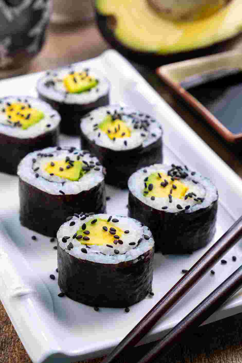 Avocado Roll Recipe: Slice each sushi roll into six pieces and garnish with sesame seeds.