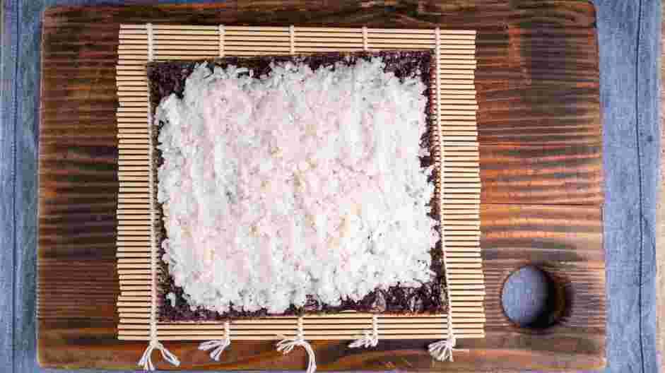 Spicy Salmon Roll Recipe: Even spread about ½ cup of sushi rice on top of the nori.