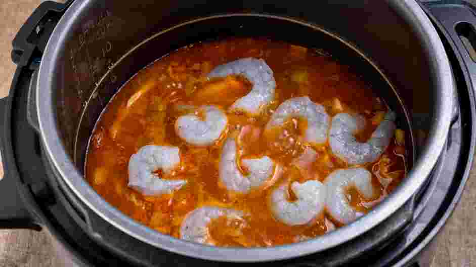 Instant Pot Jambalaya Recipe: Stir in the stock, Cajun seasoning and salt.