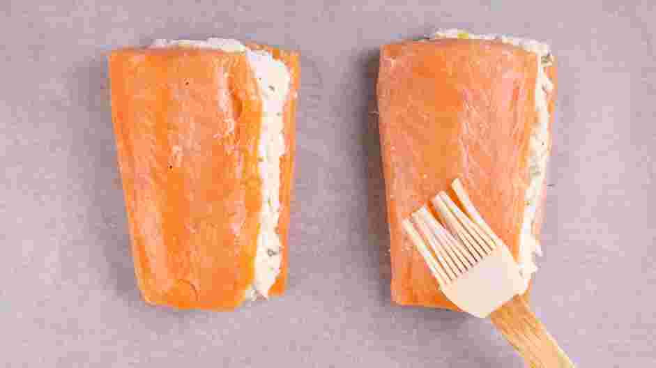 Crab Stuffed Salmon Recipe: Transfer the salmon filets onto a baking sheet lined with parchment paper.