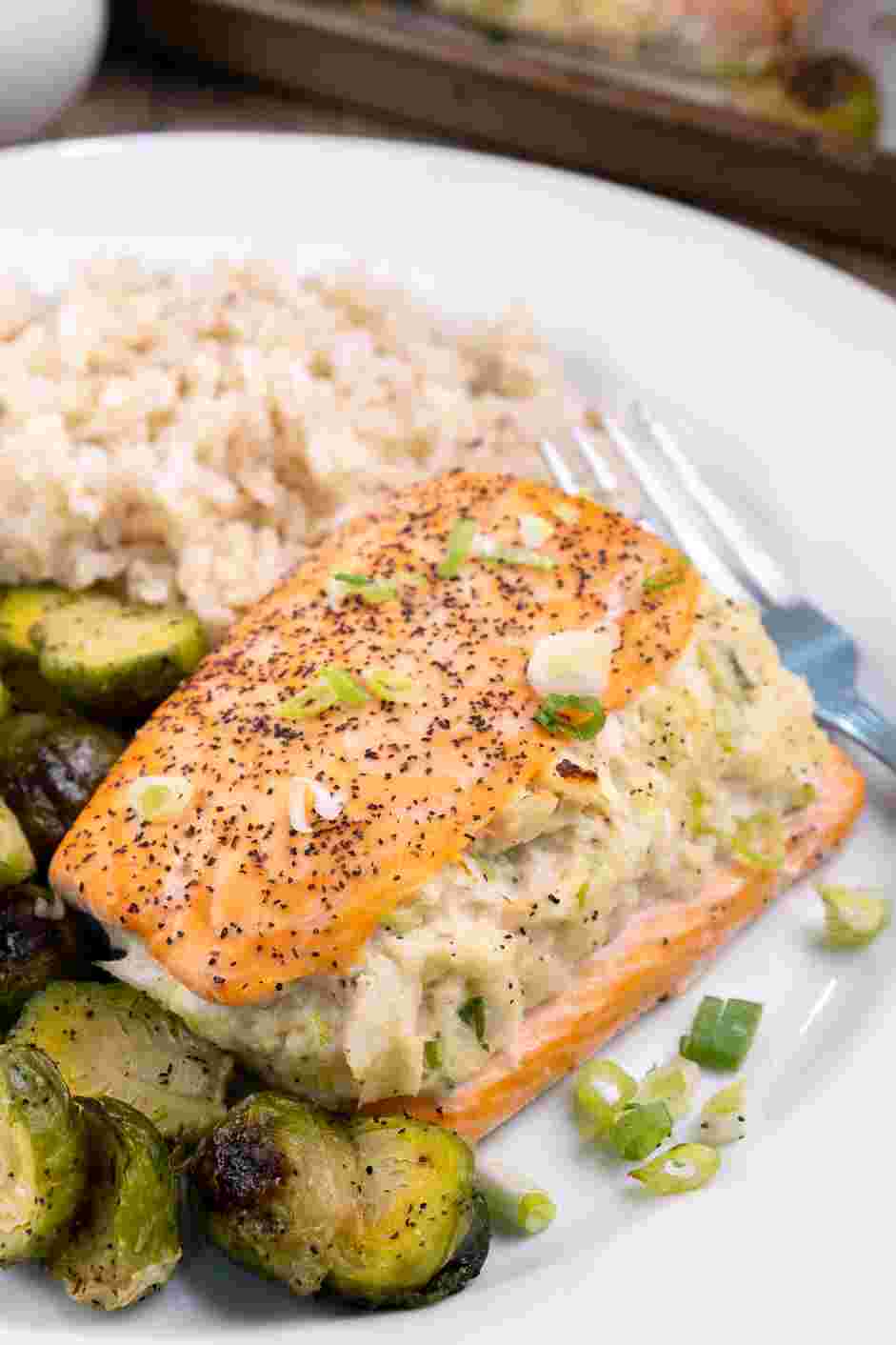 Crab Stuffed Salmon Recipe: Garnish with chopped spring onions.