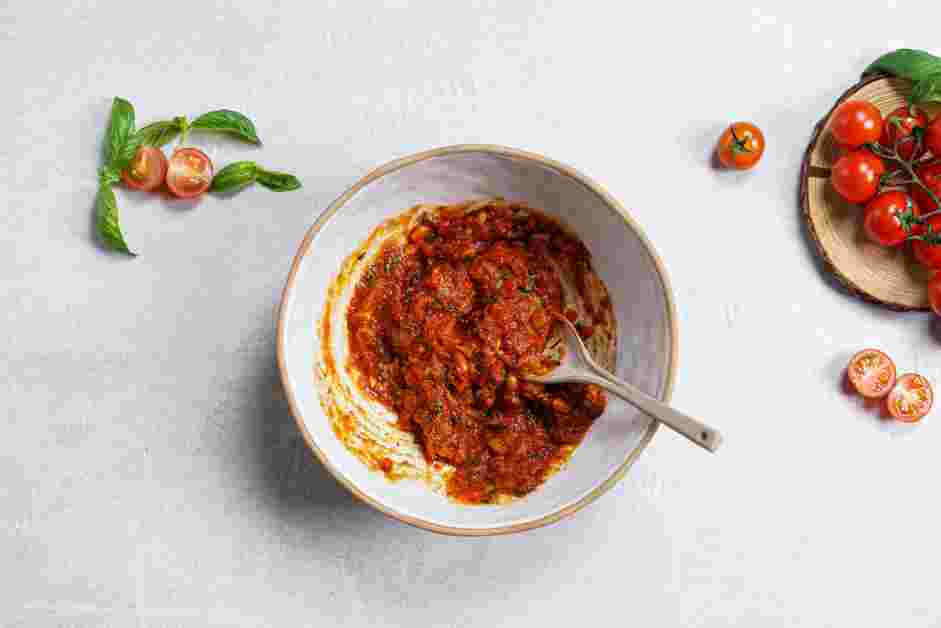 Portobello Mushroom Pizza Recipe: In a mixing bowl, add the reserved chopped mushroom stems, marinara sauce, basil and crushed red pepper.