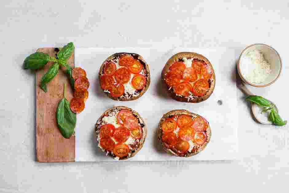 Portobello Mushroom Pizza Recipe:
Top the marinara sauce with mozzarella and Parmesan cheese.
