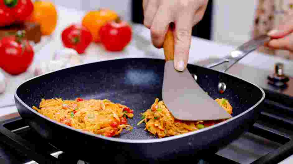 Sweet Potato Hash Browns Recipe: Cover the skillet and reduce heat to medium.