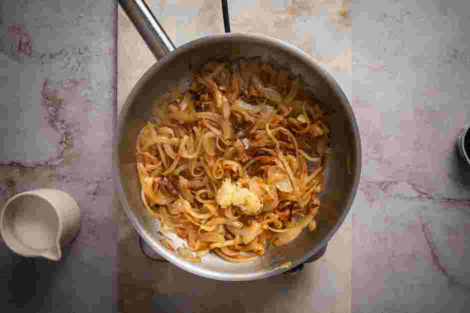 Caramelized Onion Dip Recipe: Add the garlic cloves and the Worcestershire sauce to the pan and cook for about 2-3 minutes.