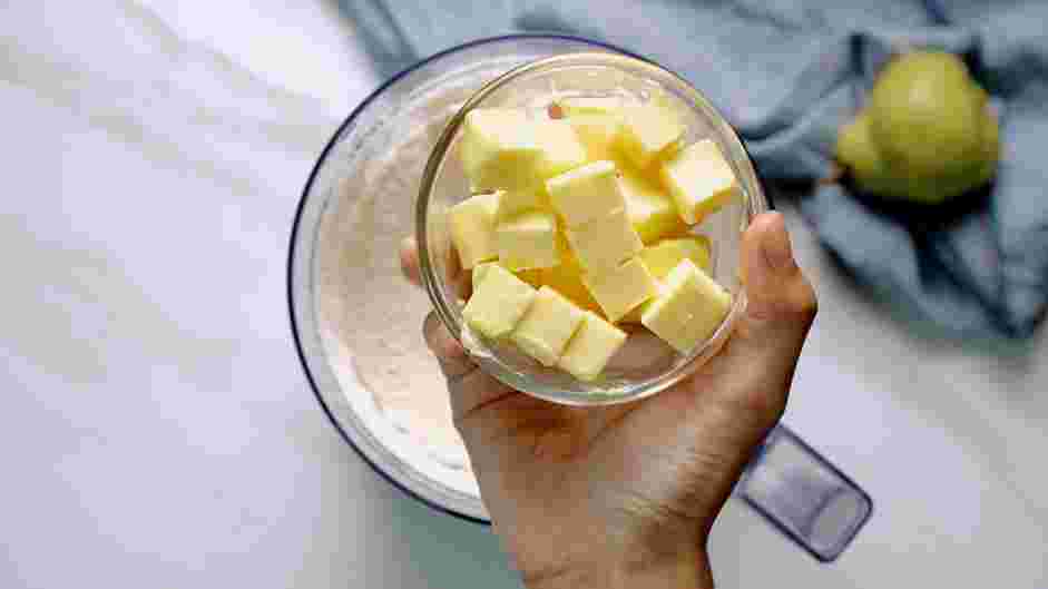 Pear Galette Recipe: Add the cubed unsalted butter, and pulse until coarse, pea-sized crumbs form.