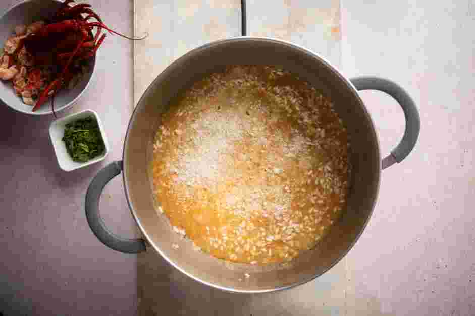 Lobster Risotto Recipe: Stir in the white wine and Parmesan cheese.