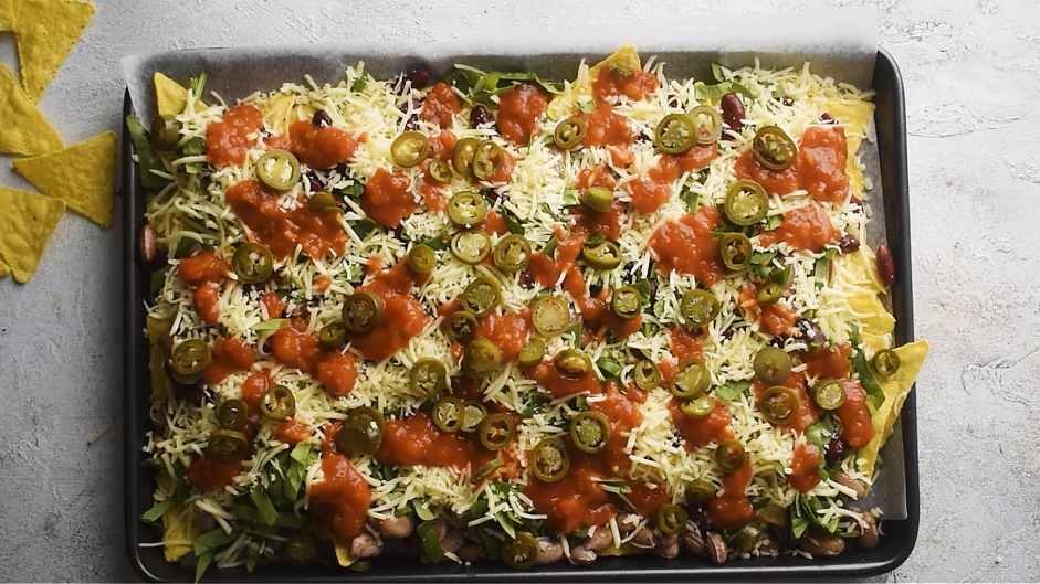Sheet Pan Nachos Recipe: Finally, top with the jalapeños.