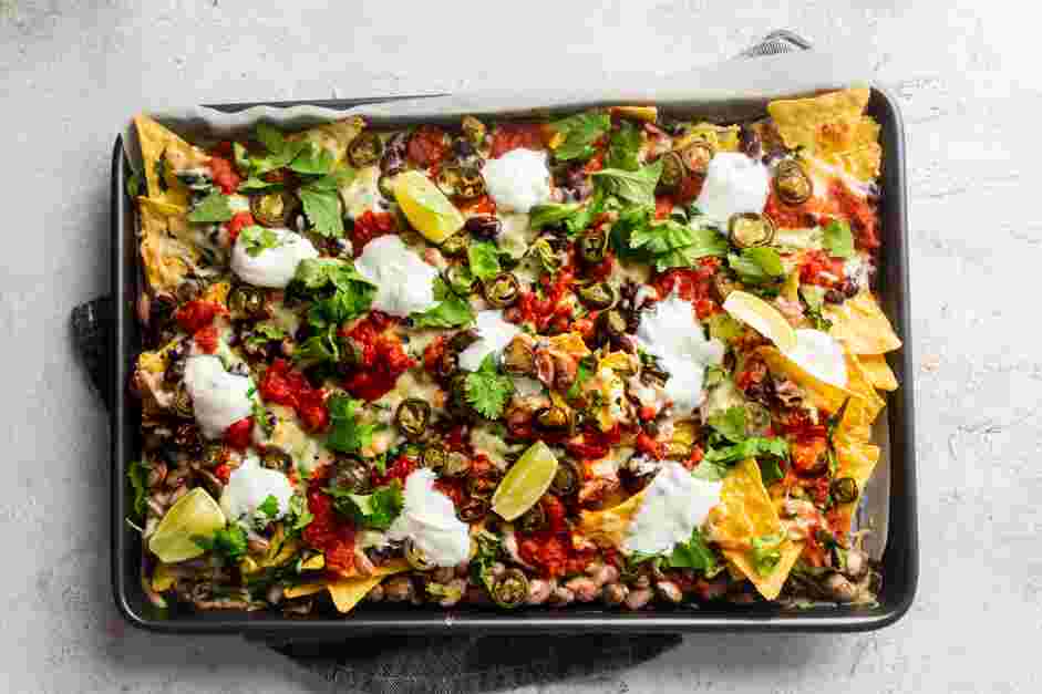 Sheet Pan Nachos Recipe: 
Bake at 350&deg;F until the cheese melts and starts to bubble.