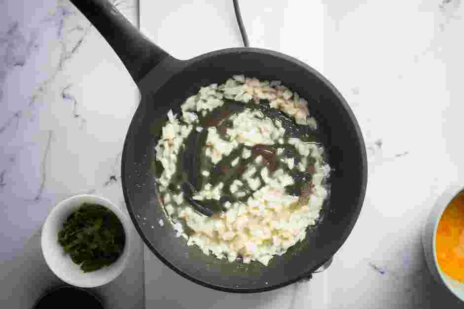 Spinach Omelette Recipe: Saut&eacute; the onions until softened.