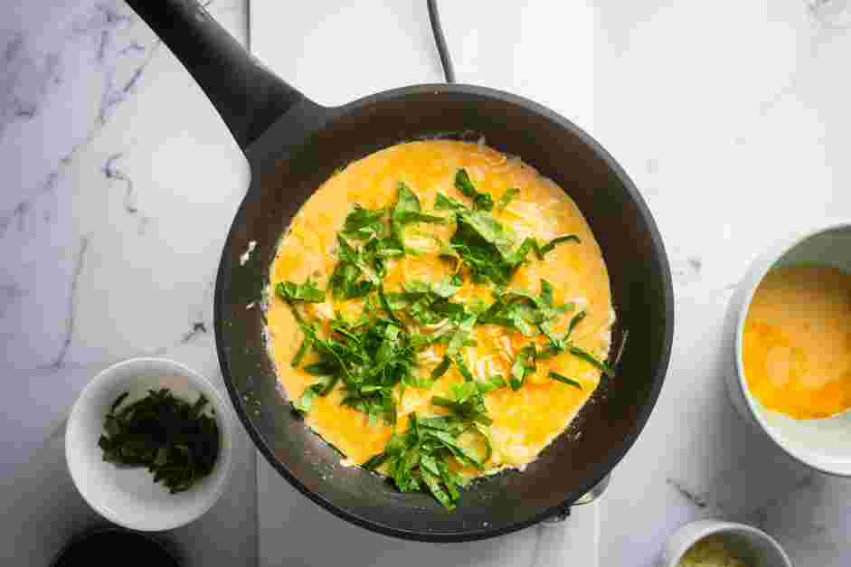 Spinach Omelette Recipe:
Spread half of the shredded spinach over the cheese.