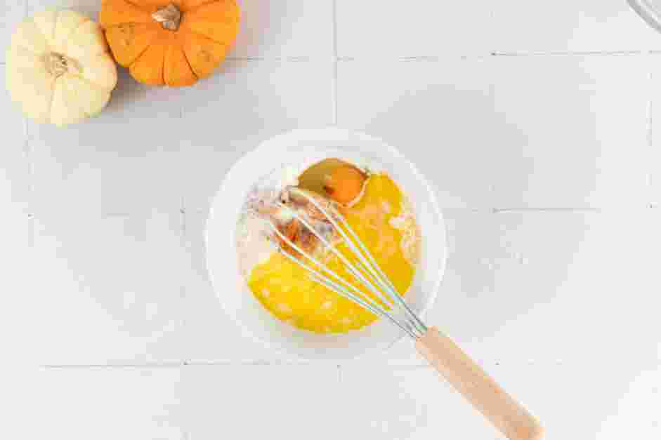 Pumpkin Pancakes Recipe: In a medium mixing bowl or a large measuring cup, whisk together the buttermilk, pumpkin puree, melted butter, egg and vanilla extract.