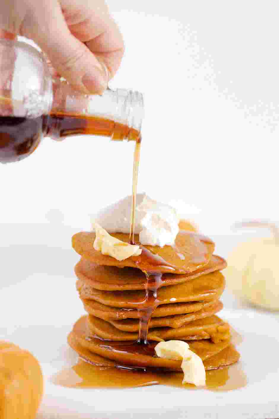 Pumpkin Pancakes Recipe: Serve immediately topped with maple syrup, butter and whipped cream.