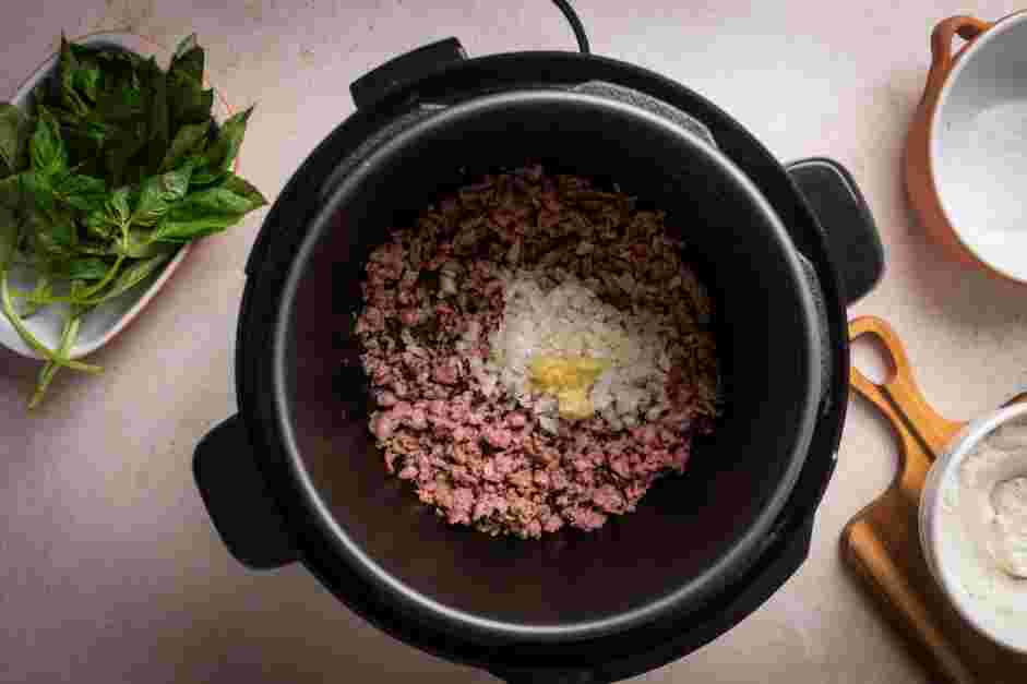 Instant Pot Lasagna Soup Recipe: Add the onion and garlic and cook until slightly softened, about 3 minutes.