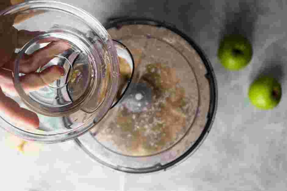 Mini Apple Pies Recipe: With the food processor running, add the ice water.