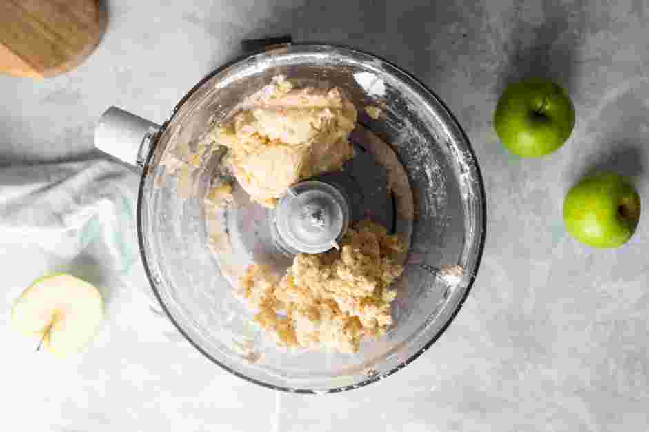 Mini Apple Pies Recipe: Continue blending until the dough starts to come together, no more than 30 seconds.