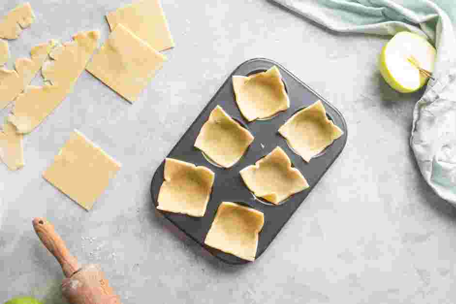 Mini Apple Pies Recipe: Press each square into a muffin pan.