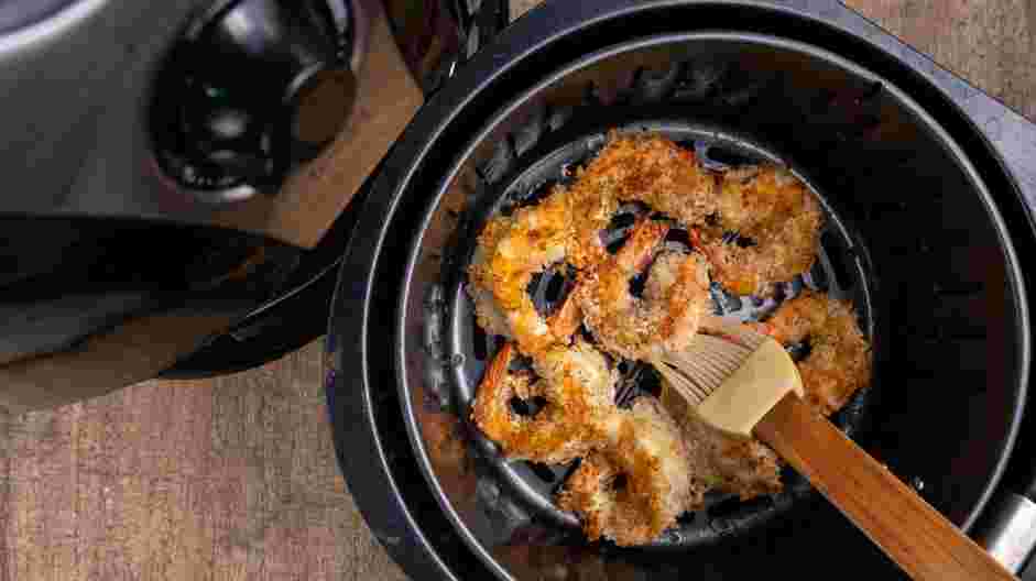 Air Fryer Fried Shrimp Recipe: 
Open the air fryer and dust the shrimp with a little oil and flip shrimp over.