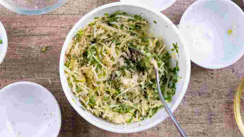 Brick Chicken Recipe: In a small bowl, combine three tablespoons of olive oil with the garlic, Parmesan cheese, oregano, parsley, chives and thyme.