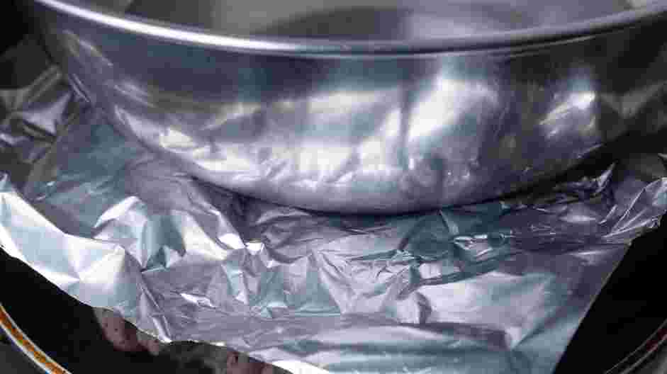 Brick Chicken Recipe: Place two aluminum foil wrapped bricks on top of the chicken or place a piece of foil over the chicken and place your dutch oven, heavy pot or a second cast-iron skillet on top.