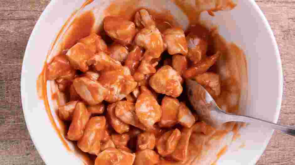 Buffalo Chicken Pasta Recipe:
In a shallow bowl, add the buffalo sauce and the poached chicken.