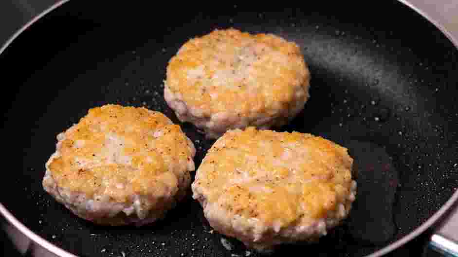 Burger Bite Recipe: Place burgers inside the skillet and cook each burger for 3-4 minutes.