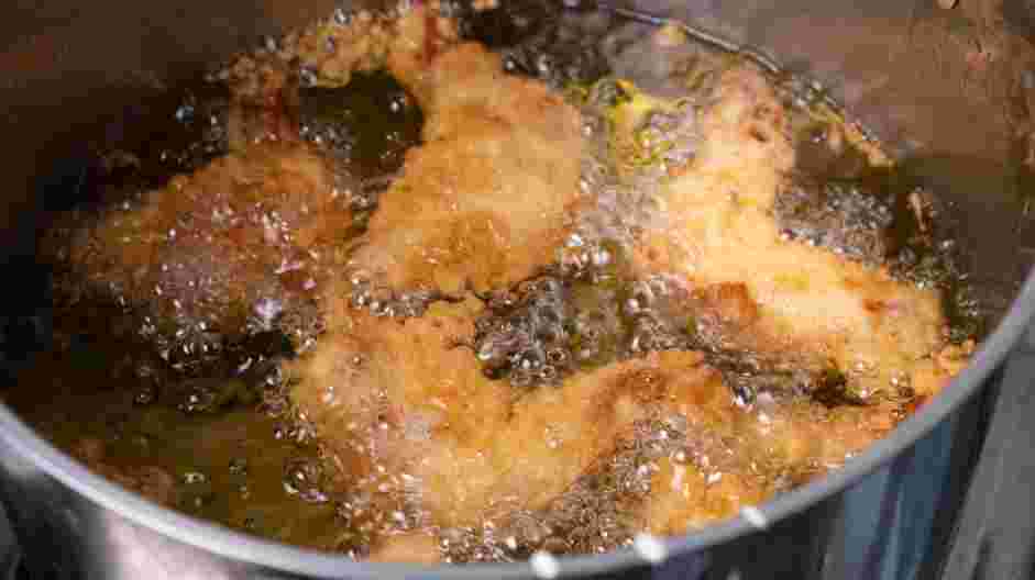 Honey Butter Fried Chicken Recipe: Fry the chicken until it is cooked through or the internal temperature of the chicken reads 165°F.