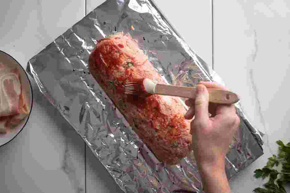 Bacon Wrapped Meatloaf Recipe: Using a silicone brush, brush the meatloaf with the meatloaf glaze.