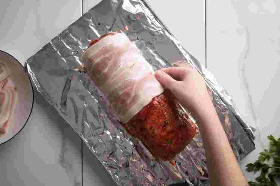 Bacon Wrapped Meatloaf Recipe:
Layer the bacon slices, crosswise, tucking the ends under the loaf.