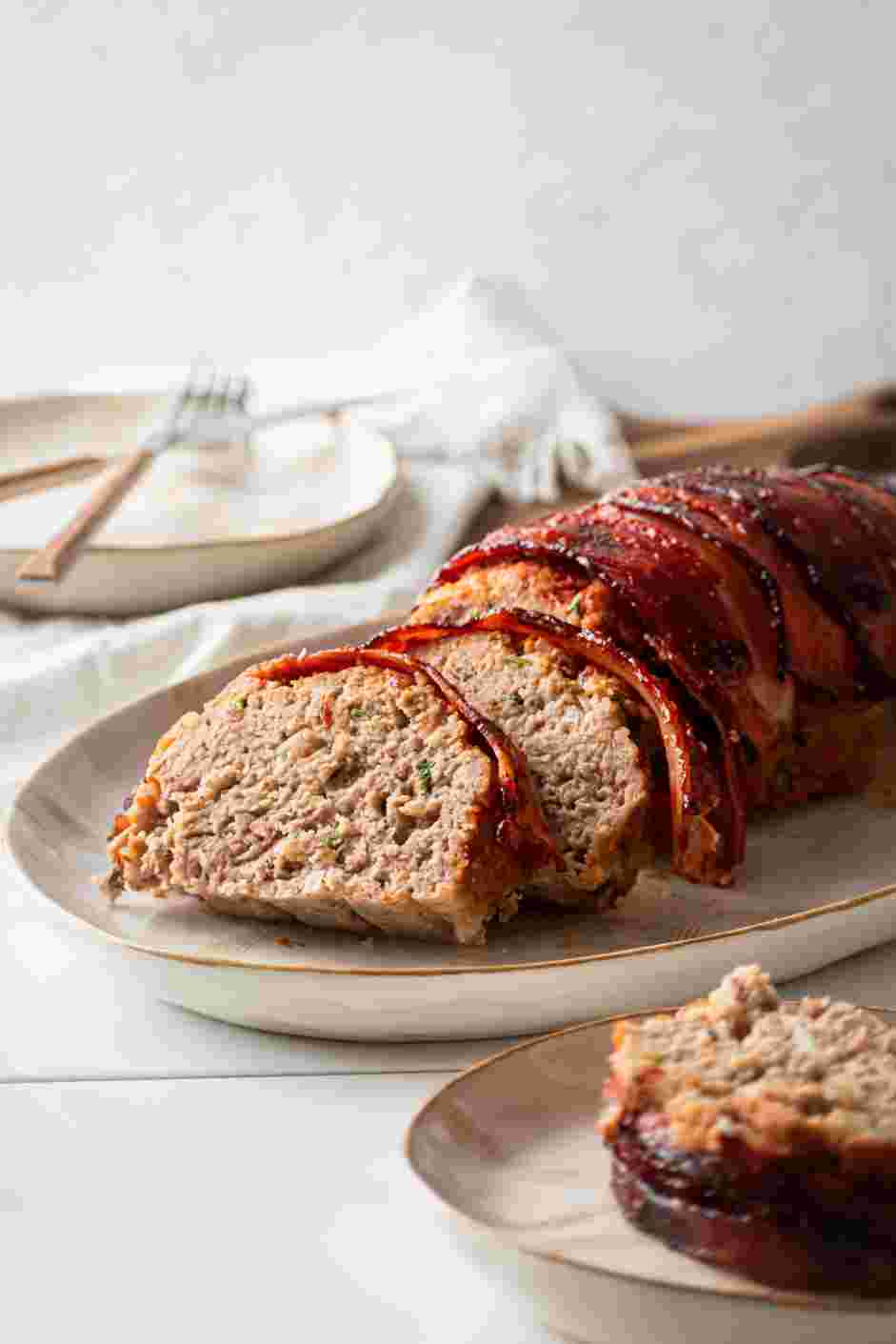 Bacon Wrapped Meatloaf Recipe: Garnish with fresh parsley and serve with a side of steamed vegetables and mashed potatoes.