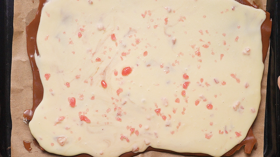 Chocolate Peppermint Bark Recipe: 
Sprinkle the remaining peppermint candy on top of the white chocolate.