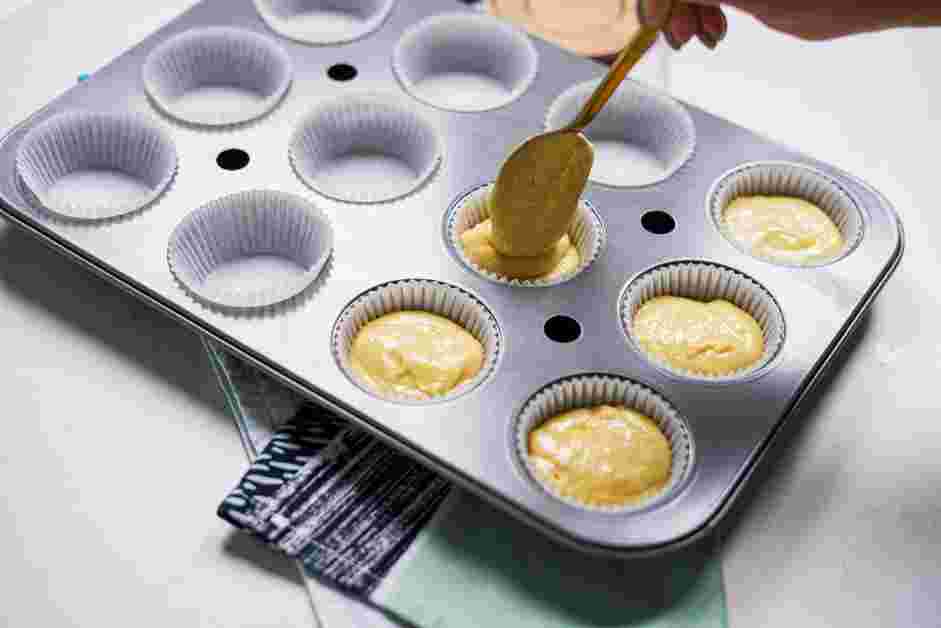 Cornbread Muffins Recipe: Transfer the batter into the prepared muffin pan.