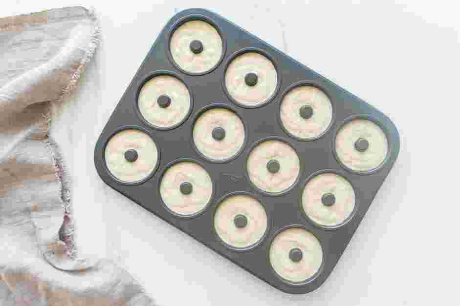 Cake Donut Recipe: Fill the prepared doughnut pans with the batter until ¾ full.