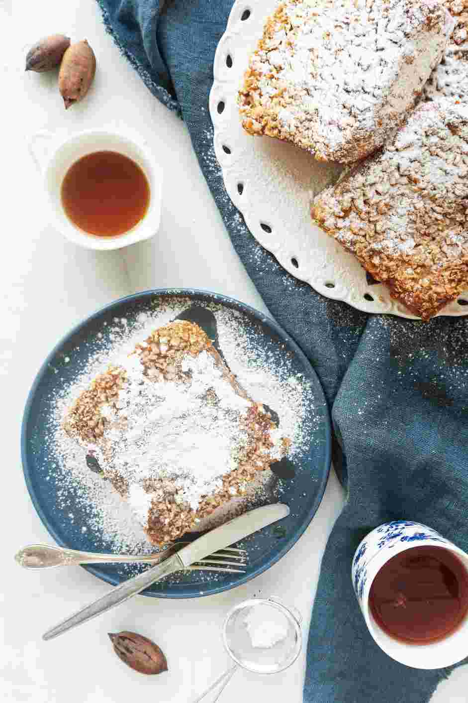 Eggnog French Toast Recipe: Top the eggnog French toast with powdered sugar and maple syrup.