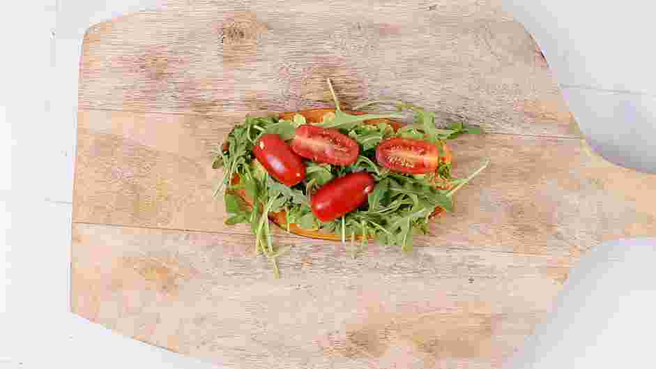 Sweet Potato Toast Recipe: Top the avocado with a small bunch of arugula and cherry tomatoes.