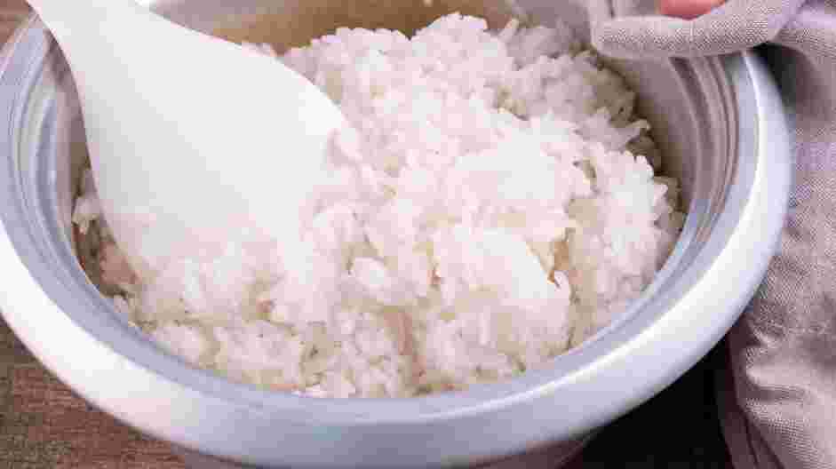 Tuna Roll Recipe: After the rice is cooked, empty the hot rice in a flat container or a large bowl.