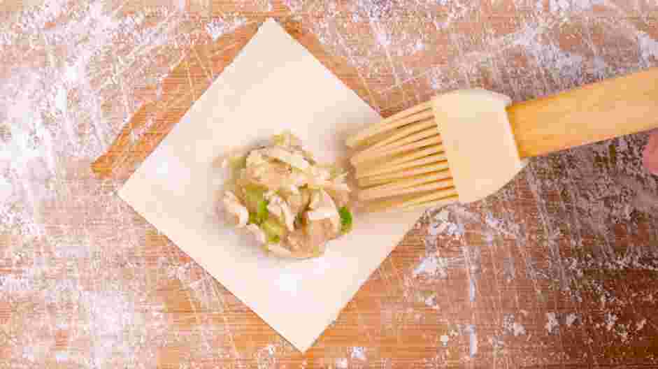 Chicken Wonton Recipe: Using a pastry brush, wet the edges of the wonton with very little water to prevent it from getting soggy.