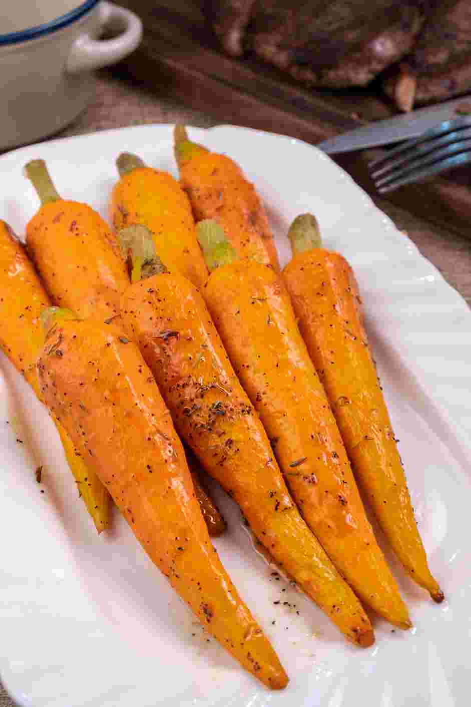 Honey Roasted Carrots Recipe:
Place the carrots on a serving platter and let the dressing left in the pan cool and thicken for a minute before drizzling over the carrots.